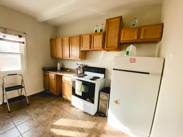 our kitchen before the cabinets fell off the wall